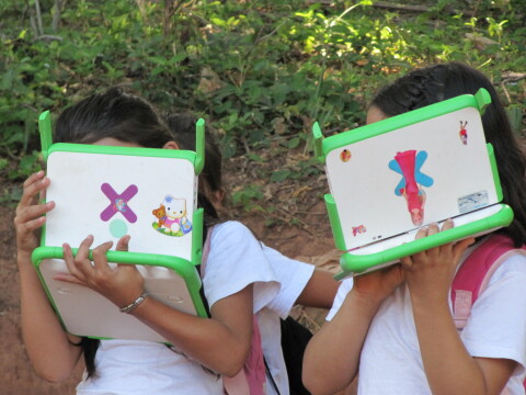 Shy girls hide behind their Barbie-fashioned laptops